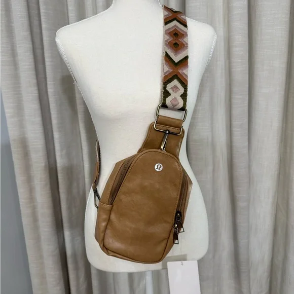 lululemon athletica Tan Leather Crossbody Sling with Patterned Strap - Picture 1 of 6